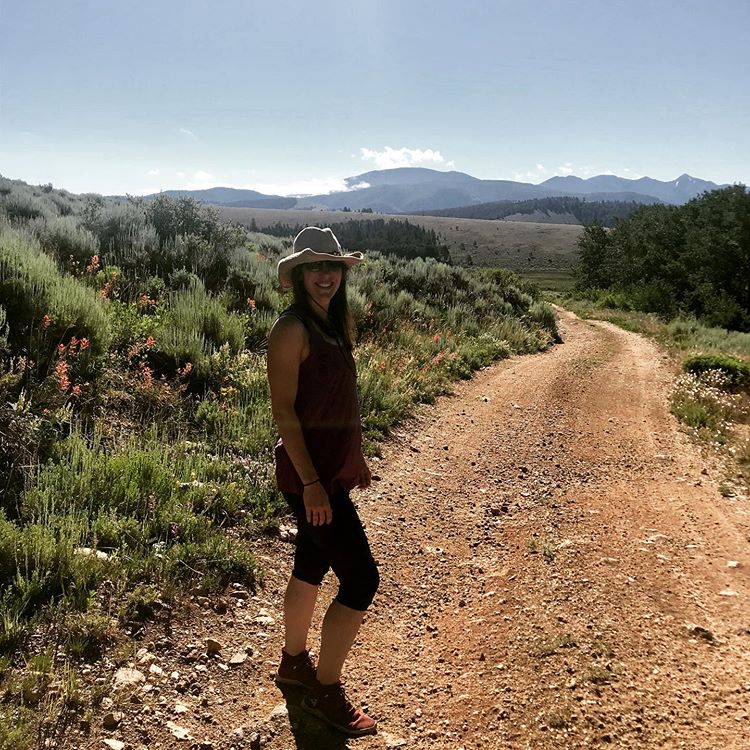 Kate at the beginning of a gravel road